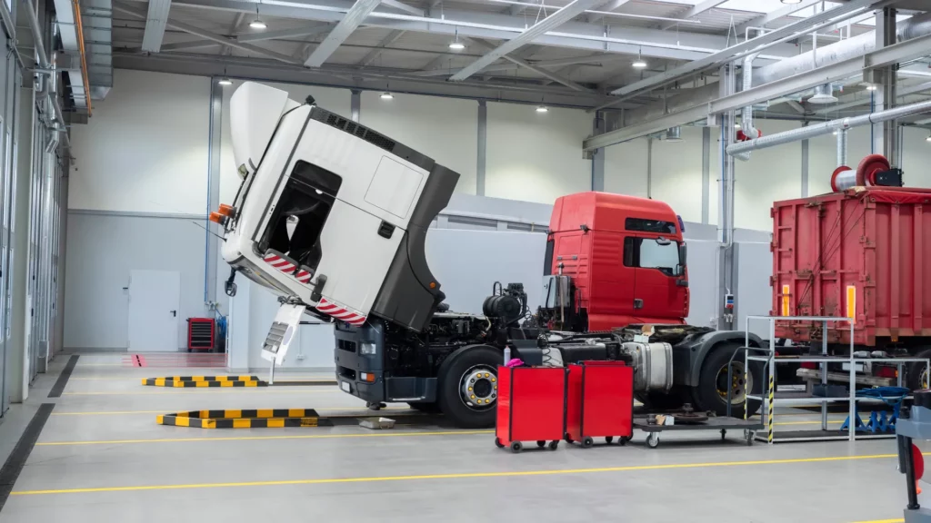 Heavy commercial truck standing in a workshop during repairs causing fleet downtime.